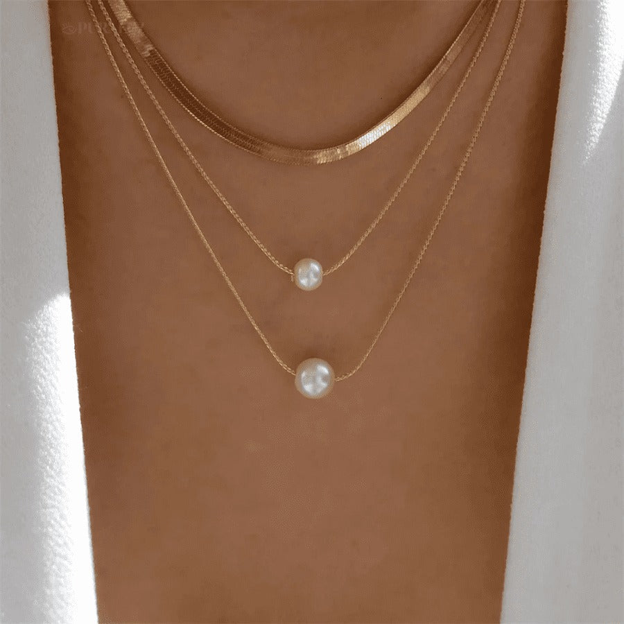 Divine necklace set; Pearl and crucifix jewelry; Elegant pearl necklaces; Stylish crucifix pendants; Handmade pearl jewelry; Christian faith necklaces; Unique pearl and crucifix design; Versatile necklace set; Fashionable religious jewelry; Statement pearl necklaces; Personalized crucifix necklaces; Luxurious pearl and gold jewelry; Spiritual symbolism necklaces; Layered pearl necklace set; Artisan-crafted crucifix jewelry; Gift for faith; Beautifully designed pearl necklaces; Modern crucifix jewelry;