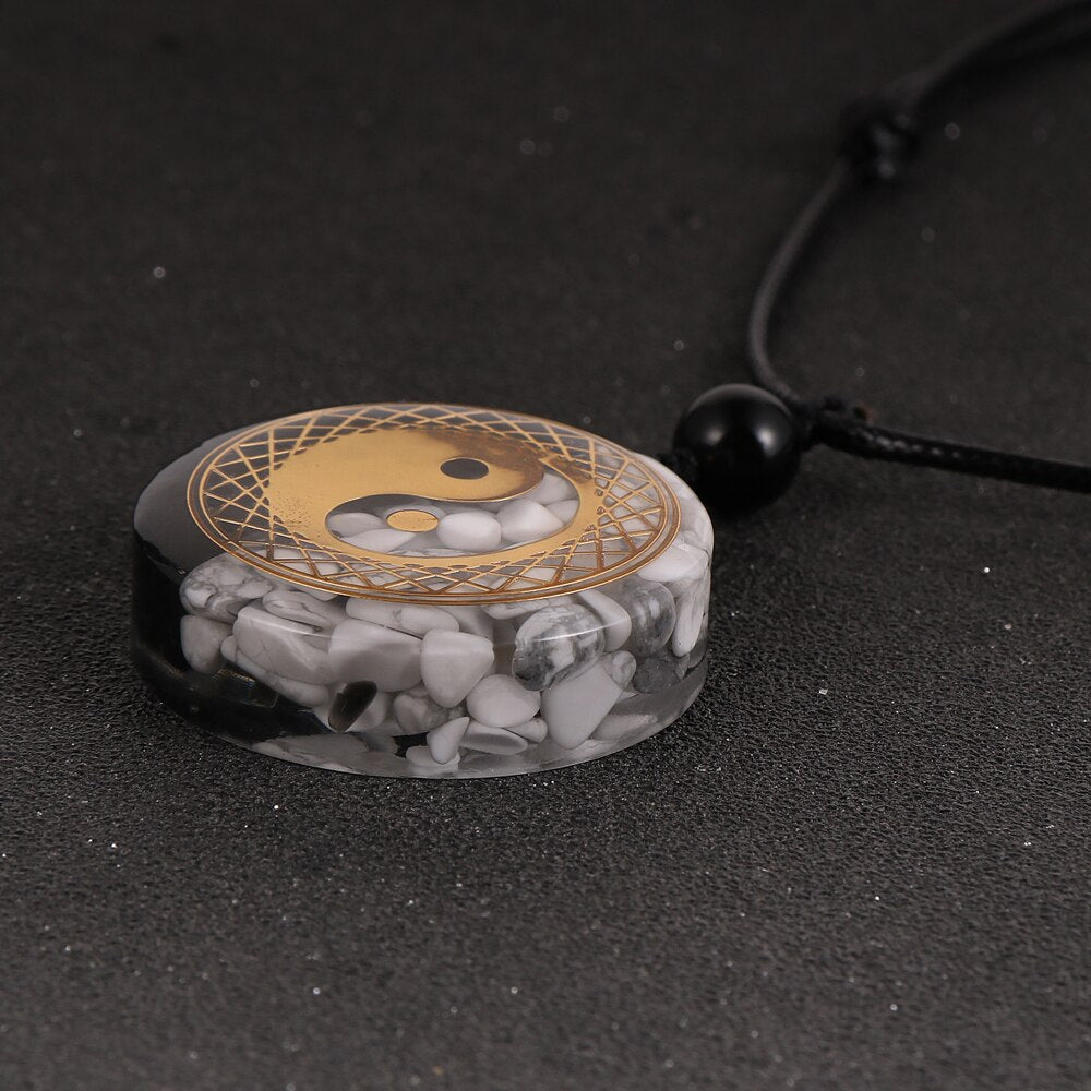 Yin Yang orgonite necklace; Handcrafted spiritual jewelry; Unique design for balancing energies; Artisan-crafted accessory; Ethically sourced materials; Gift for those seeking harmony and balance; Stylish and meaningful for everyday wear; Durable and fashionable; Beautifully detailed Yin Yang symbol for duality and unity; Unique spiritual gift; Necklace for enhancing energy flow and protection; Natural elements for emotional healing and grounding;