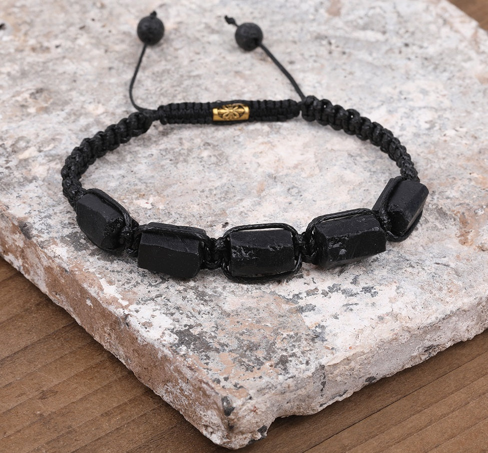 Tourmaline natural black bracelet; Handcrafted gemstone jewelry; Unique design for grounding and protection; Artisan-crafted accessory; Ethically sourced black tourmaline; Gift for wellness enthusiasts; Stylish and sleek for everyday wear; Durable and fashionable; Beautifully polished black tourmaline beads; Unique spiritual gift; Bracelet for emotional balance and stability; Natural stones for energy cleansing; Lightweight and comfortable; Ideal for meditation and healing practices;