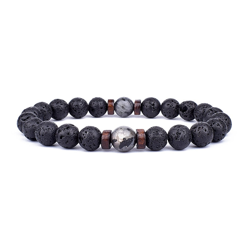Tibetan bracelet; Volcanic lava stone bracelet; Handcrafted spiritual jewelry; Unique design for grounding and strength; Artisan-crafted accessory; Ethically sourced volcanic lava; Gift for those seeking stability; Stylish and rugged for everyday wear; Durable and fashionable; Beautifully textured lava beads; Unique spiritual gift; Bracelet for protection and emotional balance; Natural stones for personal empowerment; Lightweight and comfortable; Ideal for meditation practices;