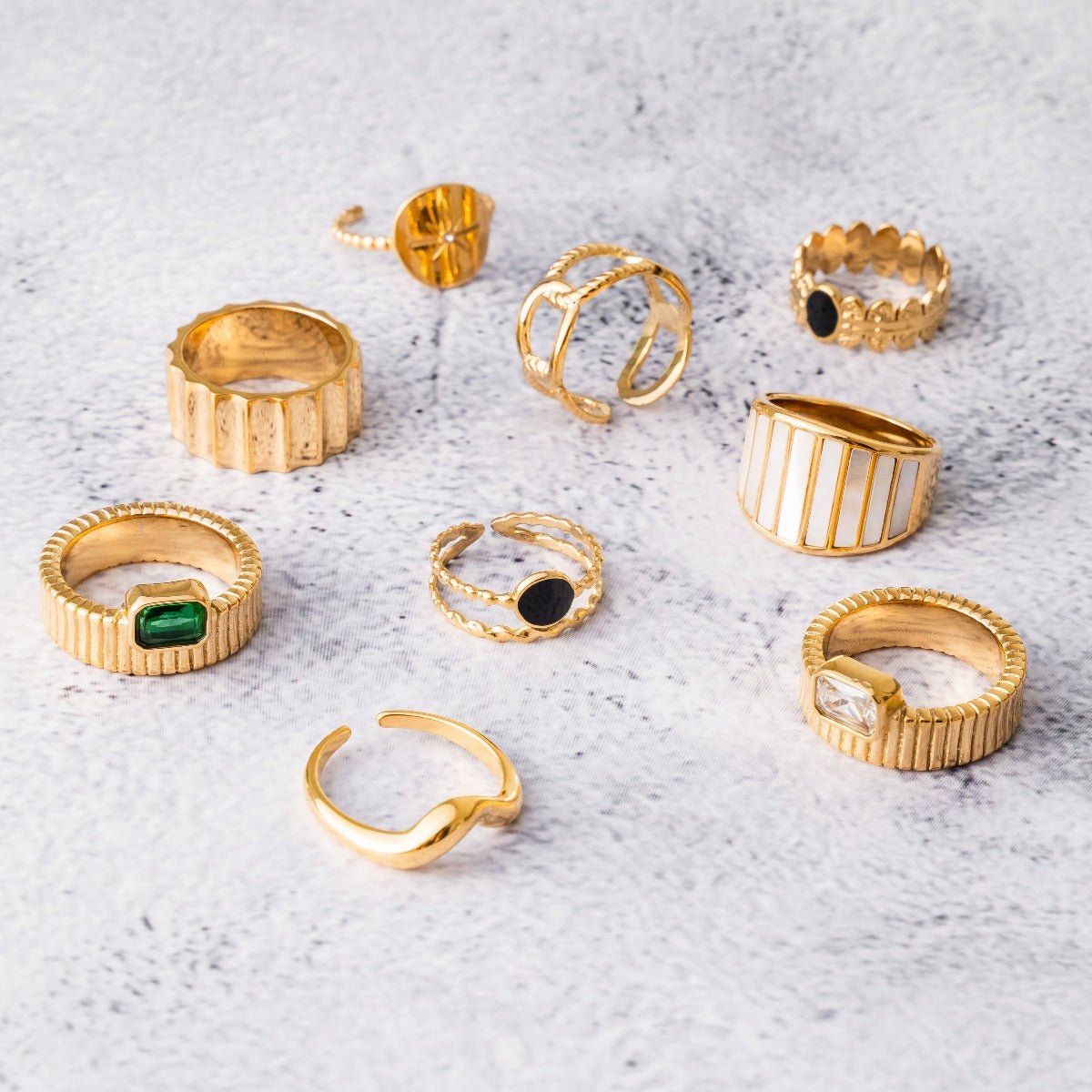 aspen ring; 18k gold-plated jewelry; elegant and modern design; stylish gold ring; luxury fashion accessory; high-quality craftsmanship; unique and eye-catching; perfect gift for her; sophisticated gold finish; versatile for any occasion; comfortable wear; contemporary elegance; durable gold plating; timeless style; statement ring; exquisite fashion piece; delicate and refined; fashionable and chic; trendy jewelry piece; unique design details;