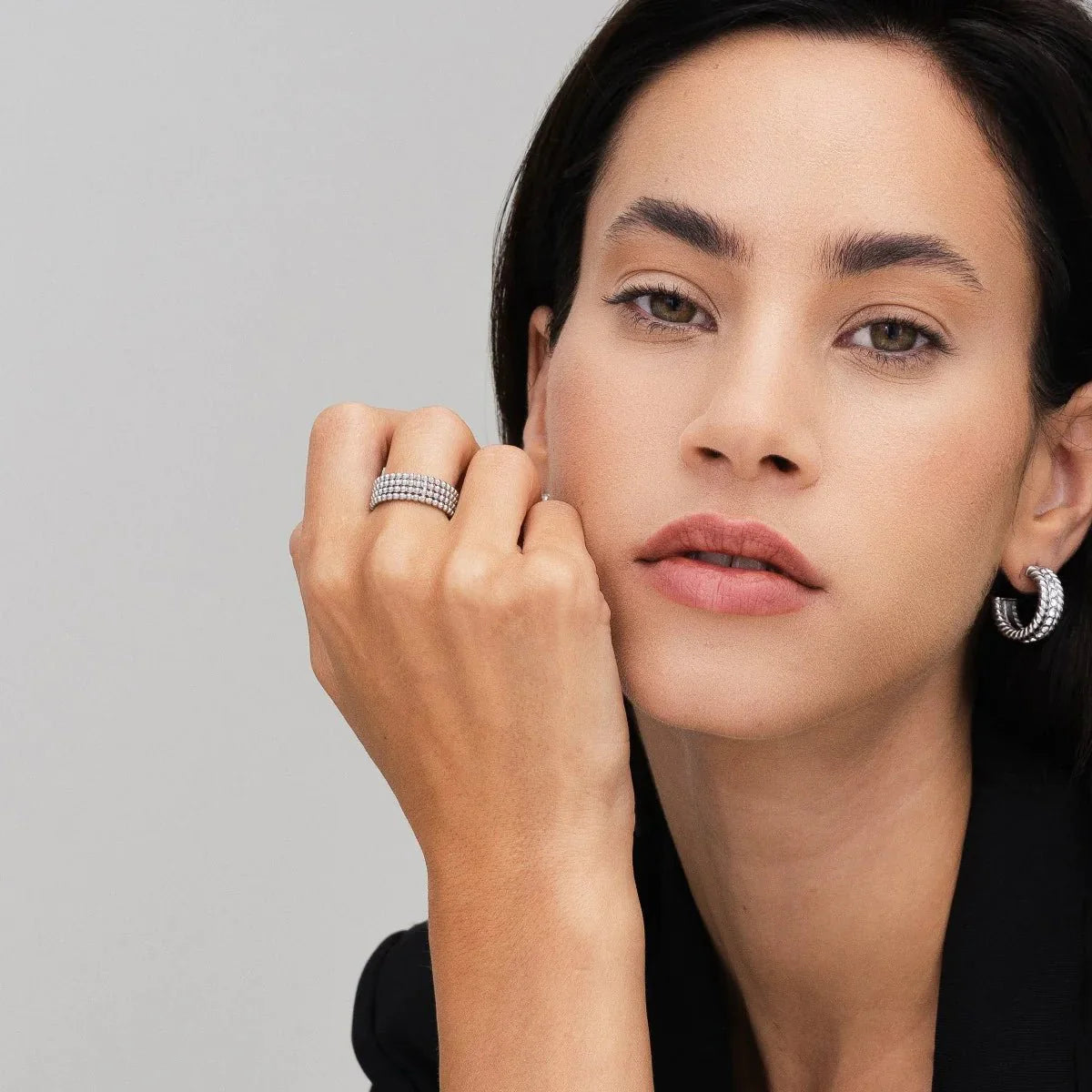 iconic spheres ring; silver jewelry; modern design ring; unique statement piece; elegant silver accessory; high-quality craftsmanship; stylish and contemporary; perfect gift for her; versatile wear; minimalist aesthetic; timeless elegance; chic fashion ring; adjustable fit; eye-catching spheres; sophisticated and sleek; luxurious appearance; refined beauty; intricate detailing; fashionable silver ring; unique gift idea; perfect for special occasions;