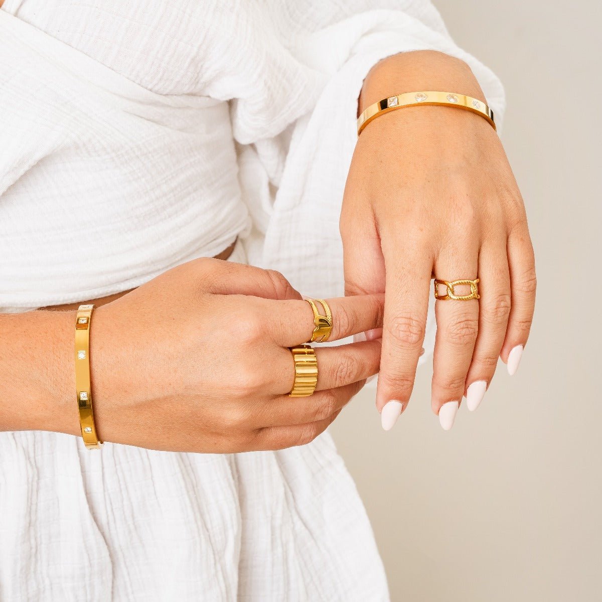 groove ring; 18k gold plated jewelry; modern design; stylish and sophisticated; unique groove detailing; elegant accessory; perfect for everyday wear; statement piece; handcrafted quality; versatile ring; comfortable fit; ideal for stacking; trendy and fashionable; luxurious shine; timeless elegance; exceptional craftsmanship; unique gift idea; bold fashion statement; contemporary style; must-have accessory; radiant finish; durable and long-lasting; flattering for all hands; eye-catching detail;