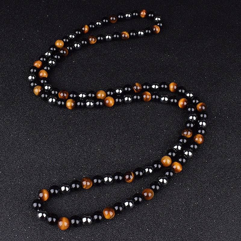 Triple protection necklace; Symbol of protection, power, and balance; Handcrafted artisan jewelry; Unique design for spiritual strength; Ethically sourced materials for conscious living; Perfect gift for those seeking inner strength; Enhances personal energy and resilience; Durable and stylish for everyday wear; Lightweight and comfortable for all-day use; Ideal for layering with other necklaces; Represents harmony and well-being; Thoughtful gift for special occasions;