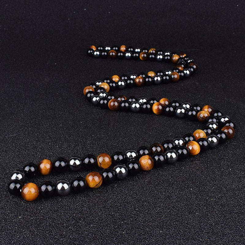 Triple protection necklace; Symbol of protection, power, and balance; Handcrafted artisan jewelry; Unique design for spiritual strength; Ethically sourced materials for conscious living; Perfect gift for those seeking inner strength; Enhances personal energy and resilience; Durable and stylish for everyday wear; Lightweight and comfortable for all-day use; Ideal for layering with other necklaces; Represents harmony and well-being; Thoughtful gift for special occasions;