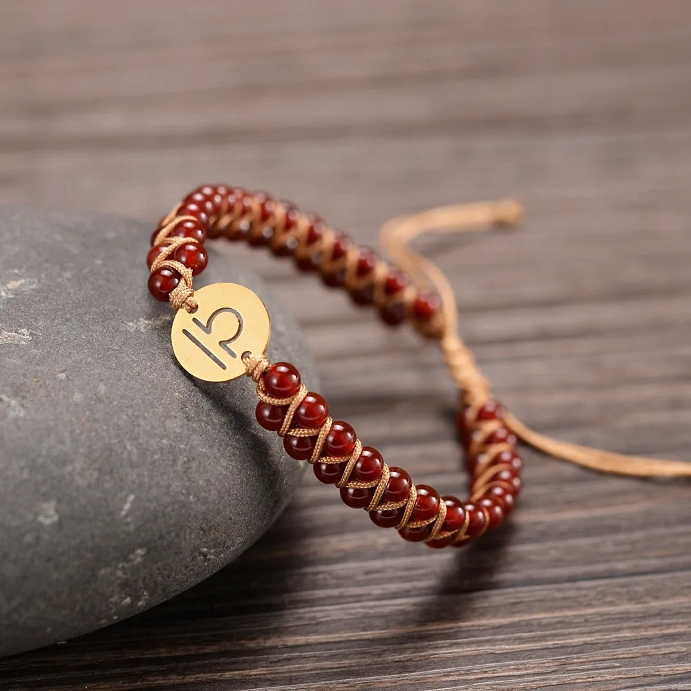 Zodiac bracelet; Braided design; Handcrafted zodiac jewelry; Unique astrological accessory; Artisan-crafted bracelet; Ethically sourced materials; Gift for astrology enthusiasts; Stylish and comfortable for daily wear; Beautiful braided details; Personalized zodiac sign representation; Perfect for layering with other bracelets; Unique spiritual gift; Bracelet for intention setting; Durable and fashionable design; Ideal for any occasion; Symbol of celestial connection;