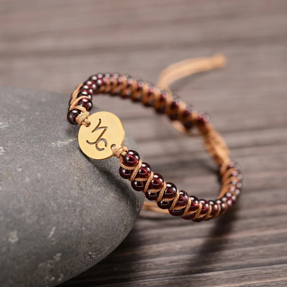 Zodiac bracelet; Braided design; Handcrafted zodiac jewelry; Unique astrological accessory; Artisan-crafted bracelet; Ethically sourced materials; Gift for astrology enthusiasts; Stylish and comfortable for daily wear; Beautiful braided details; Personalized zodiac sign representation; Perfect for layering with other bracelets; Unique spiritual gift; Bracelet for intention setting; Durable and fashionable design; Ideal for any occasion; Symbol of celestial connection;