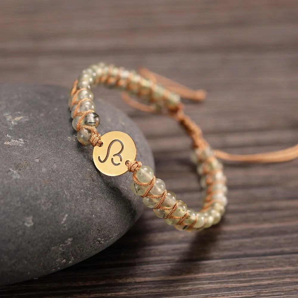 Zodiac bracelet; Braided design; Handcrafted zodiac jewelry; Unique astrological accessory; Artisan-crafted bracelet; Ethically sourced materials; Gift for astrology enthusiasts; Stylish and comfortable for daily wear; Beautiful braided details; Personalized zodiac sign representation; Perfect for layering with other bracelets; Unique spiritual gift; Bracelet for intention setting; Durable and fashionable design; Ideal for any occasion; Symbol of celestial connection;