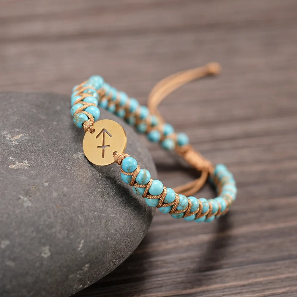 Zodiac bracelet; Braided design; Handcrafted zodiac jewelry; Unique astrological accessory; Artisan-crafted bracelet; Ethically sourced materials; Gift for astrology enthusiasts; Stylish and comfortable for daily wear; Beautiful braided details; Personalized zodiac sign representation; Perfect for layering with other bracelets; Unique spiritual gift; Bracelet for intention setting; Durable and fashionable design; Ideal for any occasion; Symbol of celestial connection;