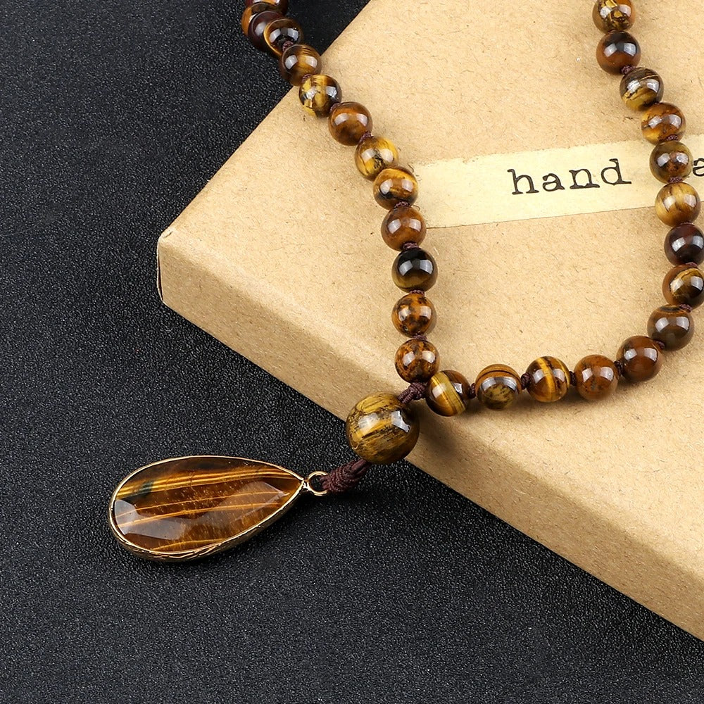 108 bead japamala; Tiger's Eye medal necklace; Handcrafted prayer beads; Spiritual jewelry; Artisan-crafted japamala; Natural Tiger's Eye beads; Japamala for mindfulness; Gift for meditation practitioners; Japamala for focus and protection; Healing energy necklace; Tiger's Eye for confidence and strength; Unique meditation necklace; Japamala for mantra repetition; Calming meditation accessory; Beautiful beaded necklace; Unique spiritual gift;