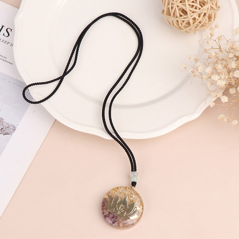 Orgonite lotus flower necklace; Handcrafted spiritual jewelry; Unique design symbolizing purity and enlightenment; Artisan-crafted accessory; Ethically sourced materials; Gift for those seeking peace and spiritual growth; Stylish and meaningful for everyday wear; Durable and fashionable; Beautifully detailed lotus flower for spiritual connection; Unique spiritual gift; Necklace for enhancing positive energy and protection; Natural elements for emotional healing and balance;
