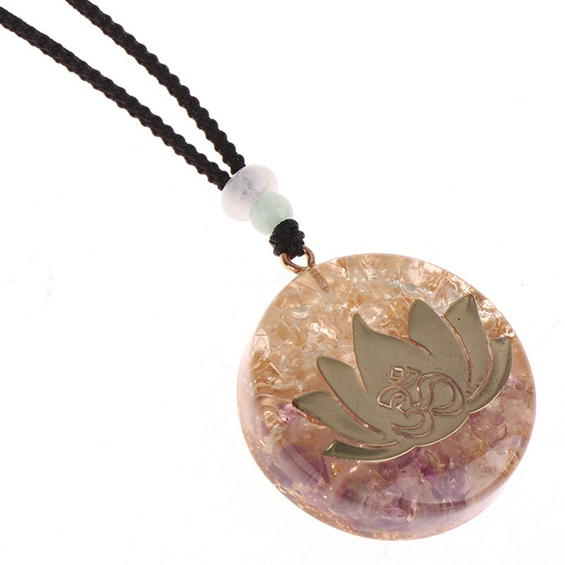 Orgonite lotus flower necklace; Handcrafted spiritual jewelry; Unique design symbolizing purity and enlightenment; Artisan-crafted accessory; Ethically sourced materials; Gift for those seeking peace and spiritual growth; Stylish and meaningful for everyday wear; Durable and fashionable; Beautifully detailed lotus flower for spiritual connection; Unique spiritual gift; Necklace for enhancing positive energy and protection; Natural elements for emotional healing and balance;