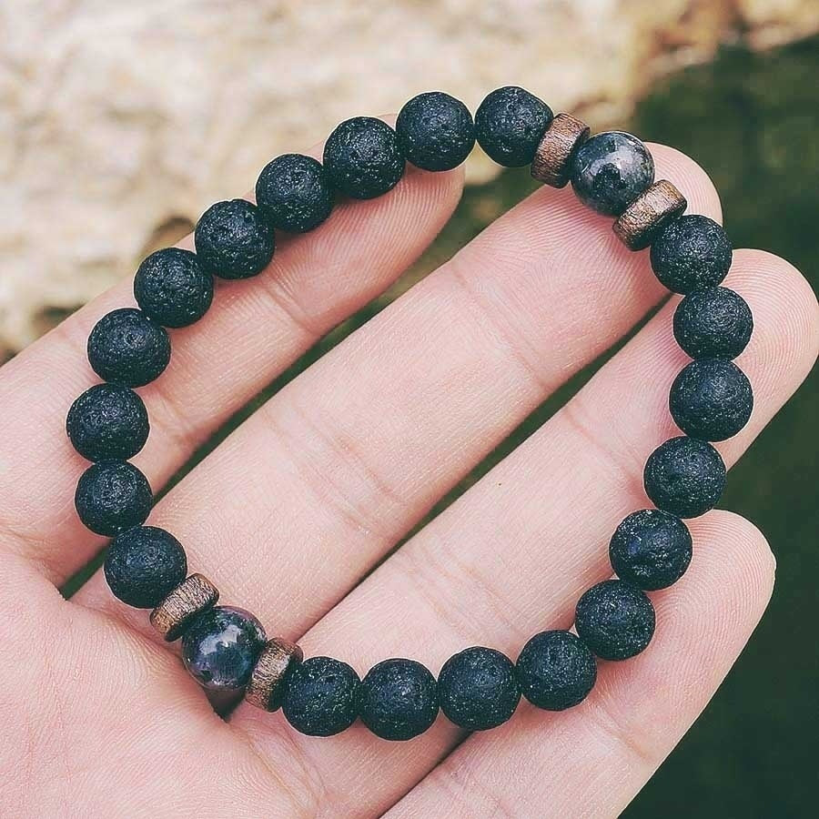 Tibetan bracelet; Volcanic lava stone bracelet; Handcrafted spiritual jewelry; Unique design for grounding and strength; Artisan-crafted accessory; Ethically sourced volcanic lava; Gift for those seeking stability; Stylish and rugged for everyday wear; Durable and fashionable; Beautifully textured lava beads; Unique spiritual gift; Bracelet for protection and emotional balance; Natural stones for personal empowerment; Lightweight and comfortable; Ideal for meditation practices;