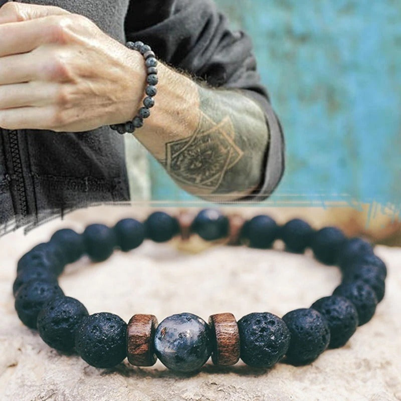 Tibetan bracelet; Volcanic lava stone bracelet; Handcrafted spiritual jewelry; Unique design for grounding and strength; Artisan-crafted accessory; Ethically sourced volcanic lava; Gift for those seeking stability; Stylish and rugged for everyday wear; Durable and fashionable; Beautifully textured lava beads; Unique spiritual gift; Bracelet for protection and emotional balance; Natural stones for personal empowerment; Lightweight and comfortable; Ideal for meditation practices;