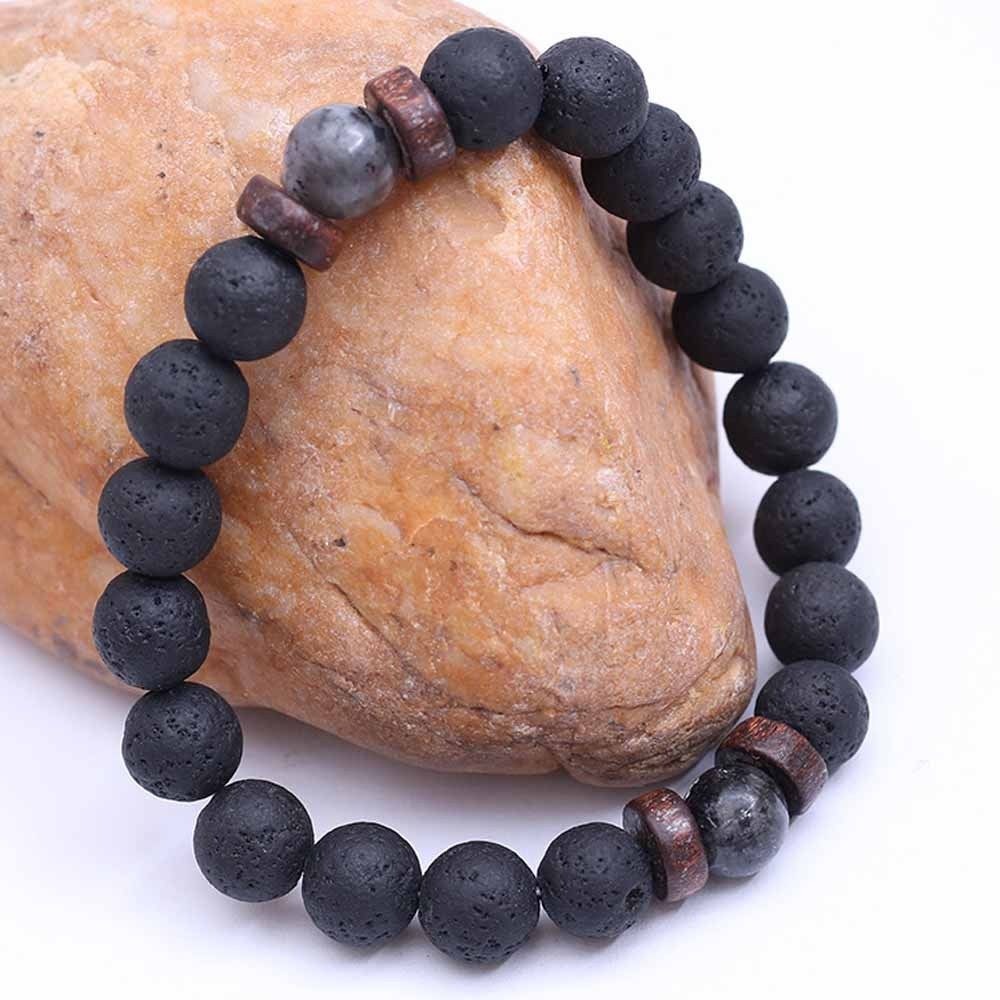 Tibetan bracelet; Volcanic lava stone bracelet; Handcrafted spiritual jewelry; Unique design for grounding and strength; Artisan-crafted accessory; Ethically sourced volcanic lava; Gift for those seeking stability; Stylish and rugged for everyday wear; Durable and fashionable; Beautifully textured lava beads; Unique spiritual gift; Bracelet for protection and emotional balance; Natural stones for personal empowerment; Lightweight and comfortable; Ideal for meditation practices;