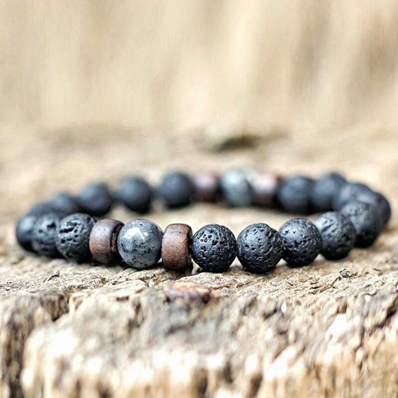 Tibetan bracelet; Volcanic lava stone bracelet; Handcrafted spiritual jewelry; Unique design for grounding and strength; Artisan-crafted accessory; Ethically sourced volcanic lava; Gift for those seeking stability; Stylish and rugged for everyday wear; Durable and fashionable; Beautifully textured lava beads; Unique spiritual gift; Bracelet for protection and emotional balance; Natural stones for personal empowerment; Lightweight and comfortable; Ideal for meditation practices;