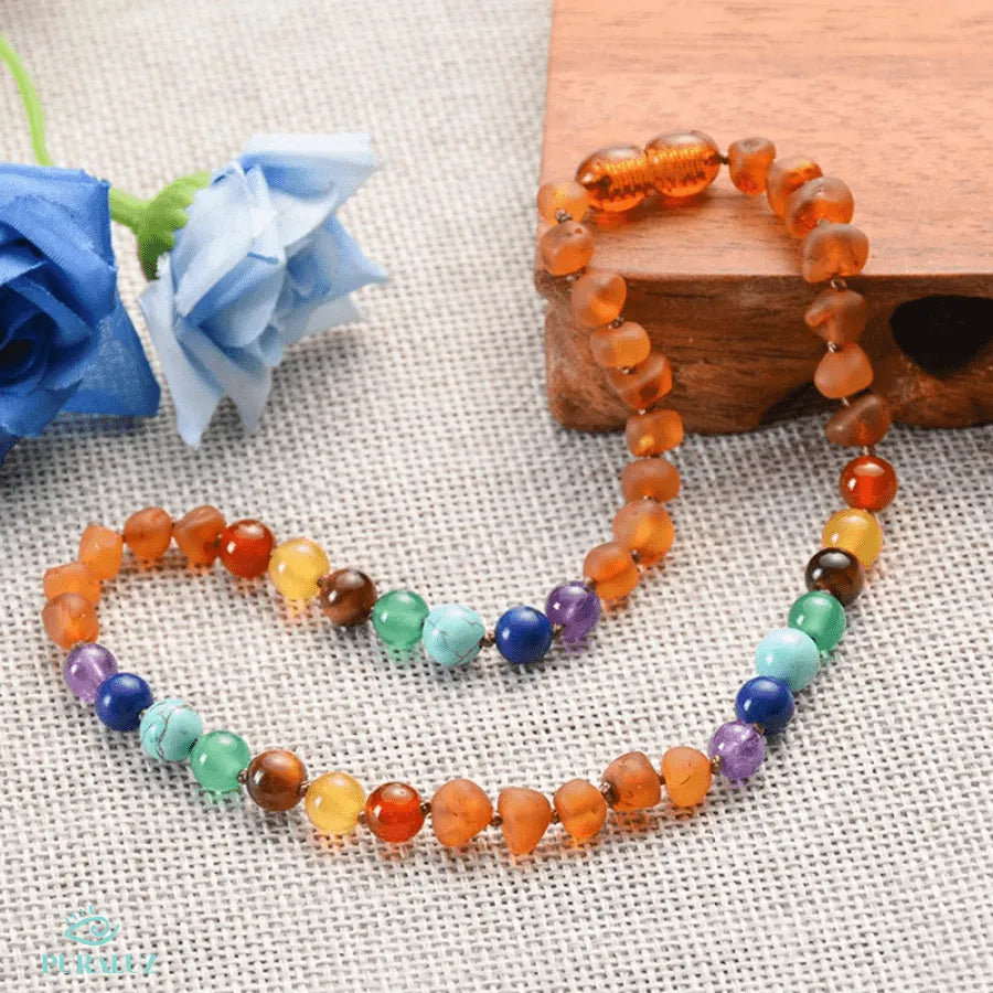 Amber necklace for babies; Soothing amber jewelry; Natural teething relief; Infant inflammation reduction; Baby amber teething necklace; Baltic amber for babies; Healing amber necklace; Safe teething solution; Baby jewelry for comfort; Amber teething solutions; Natural soothing necklace; Gentle teething remedy; Infants amber benefits; Organic amber products; Amber necklace safety; Teething discomfort relief; Natural pain relief for babies; 