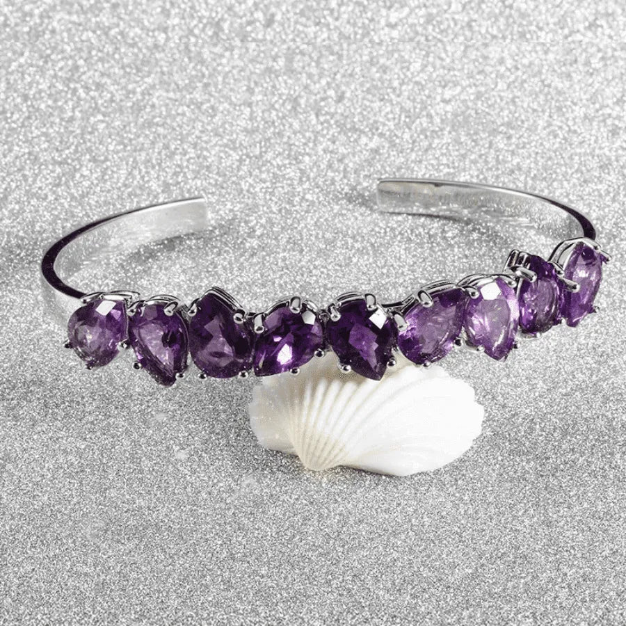 Sterling silver bracelet; Amethyst stone bracelet; Silver jewelry with amethyst; Elegant sterling silver bracelet; Handmade amethyst bracelet; Gemstone silver bracelet; Amethyst embedded bracelet; Unique sterling silver design; Stylish silver bracelet; Luxury amethyst jewelry; Birthstone bracelet; Healing stone bracelet; Adjustable silver bracelet; Fashionable amethyst piece;