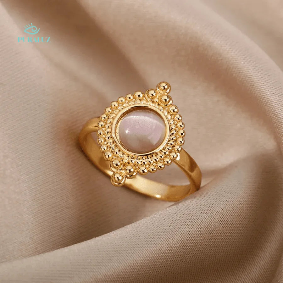 Pearl Ether ring; Elegant pearl ring; Natural pearl jewelry; Timeless pearl ring; Handcrafted pearl ring; Sophisticated pearl accessory; Classic pearl design; Elegant gemstone ring; Statement pearl ring; Luxurious pearl ring; Vintage-inspired pearl ring; Artisan pearl jewelry; Pearl and silver ring; Opulent pearl piece; Unique pearl engagement ring; 