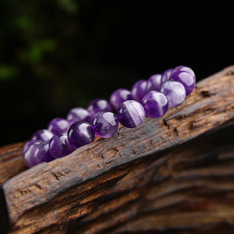 Harmony bracelet; Amethyst stone bracelet; Handcrafted gemstone jewelry; Unique design for balance; Artisan-crafted accessory; Ethically sourced amethyst; Gift for spiritual enthusiasts; Stylish and elegant for everyday wear; Durable and fashionable; Beautifully arranged amethyst beads; Unique spiritual gift; Bracelet for mindfulness and tranquility; Natural stones for emotional stability; Lightweight and comfortable; Ideal for layering with other bracelets;