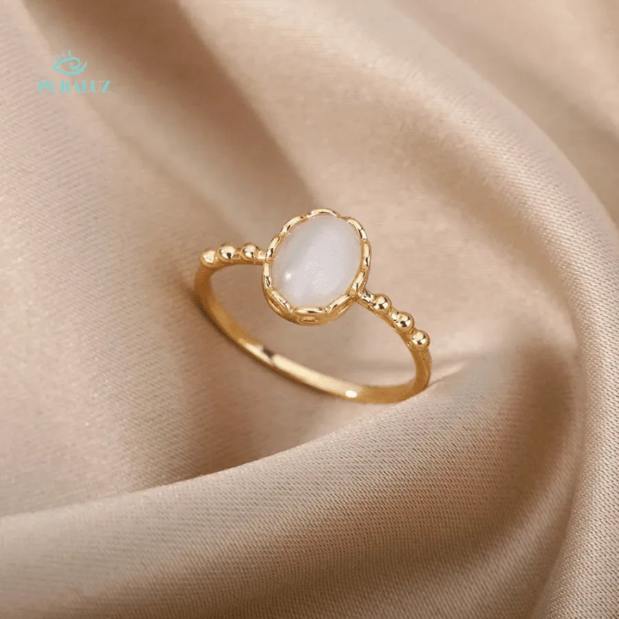 Pearl Ether ring; Elegant pearl ring; Natural pearl jewelry; Timeless pearl ring; Handcrafted pearl ring; Sophisticated pearl accessory; Classic pearl design; Elegant gemstone ring; Statement pearl ring; Luxurious pearl ring; Vintage-inspired pearl ring; Artisan pearl jewelry; Pearl and silver ring; Opulent pearl piece; Unique pearl engagement ring; 