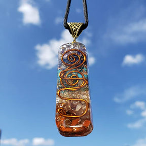 Orgonite energy flow necklace; 7 chakras amulet for balance; Enhances energy flow and healing; Unique blend of natural crystals and resin; Promotes emotional well-being and harmony; Beautifully crafted for everyday wear; Supports spiritual growth and protection; Ideal gift for holistic health enthusiasts; Handcrafted with care and intention; Vibrant colors representing each chakra; Lightweight and comfortable design;