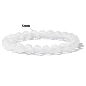 Selenite purification bracelet; Selenite stone bracelet; Handcrafted natural stone jewelry; Unique design for cleansing and healing; Artisan-crafted accessory; Ethically sourced selenite; Gift for spiritual enthusiasts; Stylish and elegant for everyday wear; Durable and fashionable; Beautifully polished selenite beads; Unique spiritual gift; Bracelet for energy clearing and purification; Natural stones for emotional balance; Lightweight and comfortable; Ideal for meditation practices;