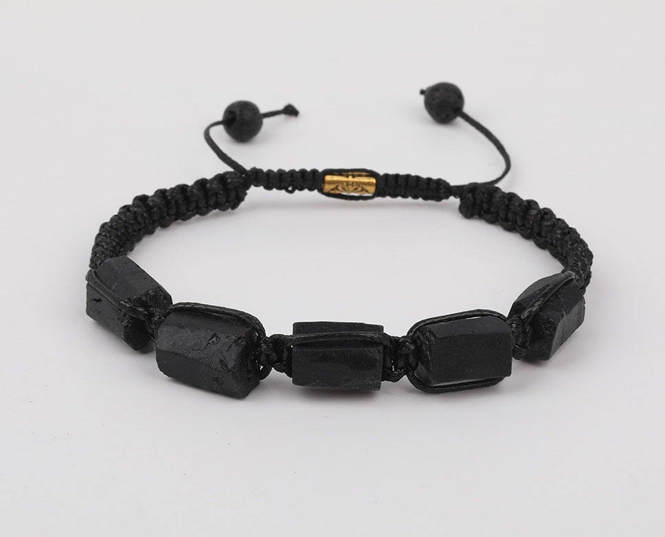 Tourmaline natural black bracelet; Handcrafted gemstone jewelry; Unique design for grounding and protection; Artisan-crafted accessory; Ethically sourced black tourmaline; Gift for wellness enthusiasts; Stylish and sleek for everyday wear; Durable and fashionable; Beautifully polished black tourmaline beads; Unique spiritual gift; Bracelet for emotional balance and stability; Natural stones for energy cleansing; Lightweight and comfortable; Ideal for meditation and healing practices;