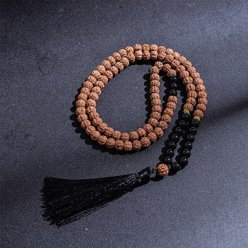 Rudraksha and Onyx japamala; Protection mala necklace; 108 beads prayer necklace; Handcrafted spiritual jewelry; Natural Rudraksha seeds; Onyx stone for protection; Artisan-crafted japamala; Japamala for mindfulness; Free bracelet included; Gift for meditation enthusiasts; Japamala for spiritual growth; Japamala for protection and grounding; Beautiful beaded necklace; Unique spiritual gift; Japamala for intention setting; Calming meditation accessory;