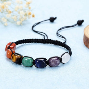 Reiki 7 chakras bracelet; Natural crystals bracelet; Handcrafted gemstone jewelry; Unique design for chakra alignment and healing; Artisan-crafted accessory; Ethically sourced materials; Gift for holistic wellness enthusiasts; Stylish and colorful for everyday wear; Durable and fashionable; Beautifully polished crystals representing each chakra; Unique spiritual gift; Bracelet for enhancing energy flow and emotional balance; Natural stones for spiritual healing and grounding; Lightweight and comfortable; 