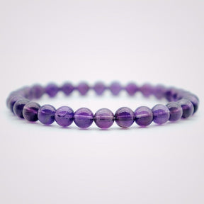 Harmony bracelet; Amethyst stone bracelet; Handcrafted gemstone jewelry; Unique design for balance; Artisan-crafted accessory; Ethically sourced amethyst; Gift for spiritual enthusiasts; Stylish and elegant for everyday wear; Durable and fashionable; Beautifully arranged amethyst beads; Unique spiritual gift; Bracelet for mindfulness and tranquility; Natural stones for emotional stability; Lightweight and comfortable; Ideal for layering with other bracelets;