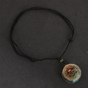 Orgonite OM necklace; Handcrafted spiritual jewelry; Unique design for energy protection and balance; Artisan-crafted accessory; Ethically sourced materials; Gift for meditation and mindfulness enthusiasts; Stylish and meaningful for everyday wear; Durable and fashionable; Beautifully detailed OM symbol for spiritual connection; Unique spiritual gift; Necklace for enhancing personal energy and harmony; Natural elements for emotional healing and grounding;