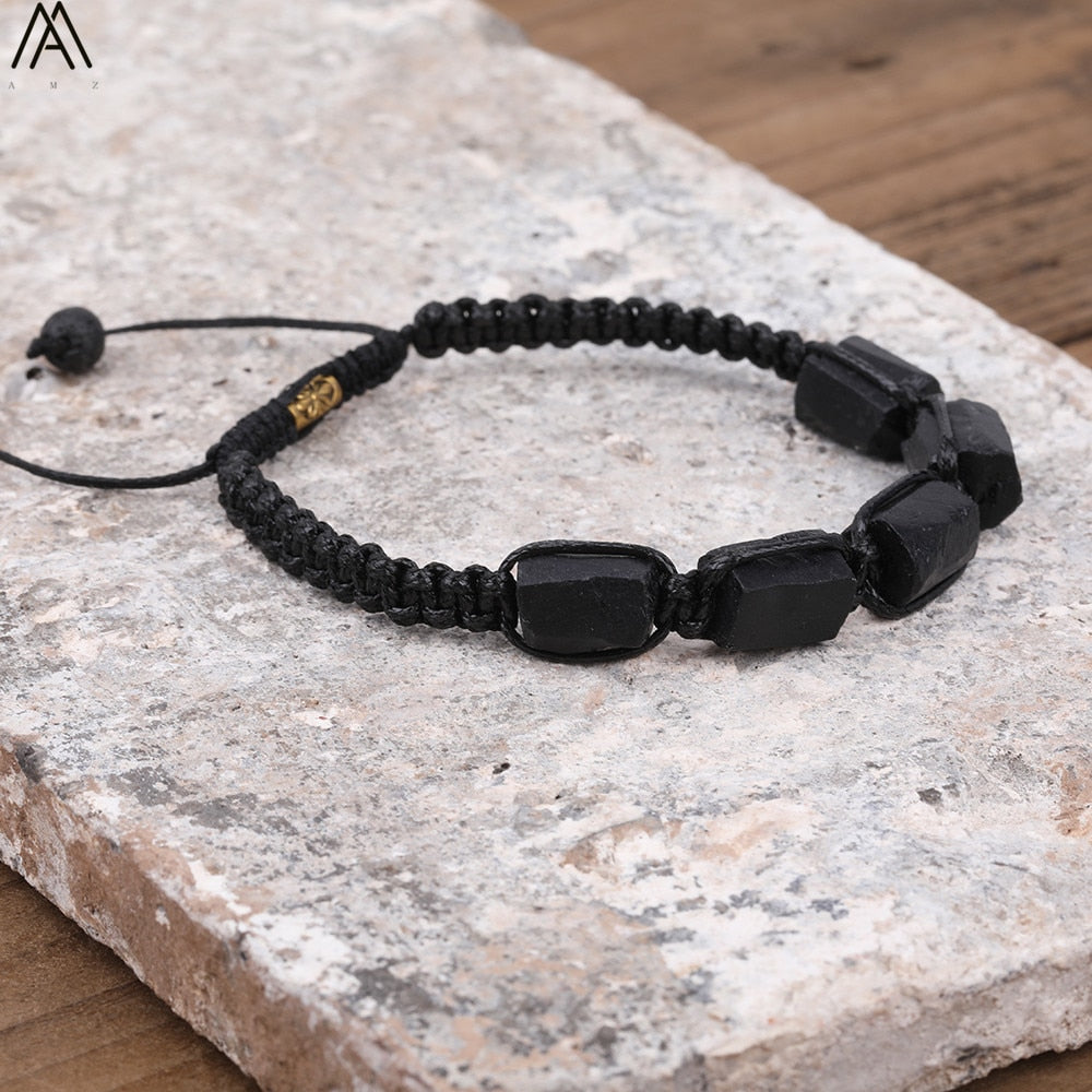 Tourmaline natural black bracelet; Handcrafted gemstone jewelry; Unique design for grounding and protection; Artisan-crafted accessory; Ethically sourced black tourmaline; Gift for wellness enthusiasts; Stylish and sleek for everyday wear; Durable and fashionable; Beautifully polished black tourmaline beads; Unique spiritual gift; Bracelet for emotional balance and stability; Natural stones for energy cleansing; Lightweight and comfortable; Ideal for meditation and healing practices;