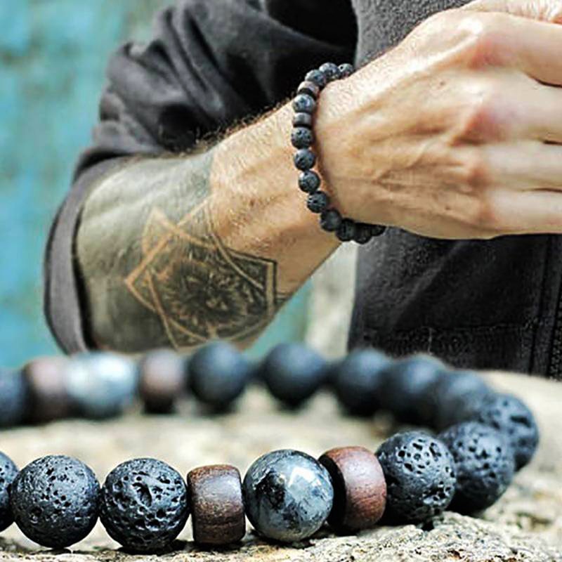 Tibetan bracelet; Volcanic lava stone bracelet; Handcrafted spiritual jewelry; Unique design for grounding and strength; Artisan-crafted accessory; Ethically sourced volcanic lava; Gift for those seeking stability; Stylish and rugged for everyday wear; Durable and fashionable; Beautifully textured lava beads; Unique spiritual gift; Bracelet for protection and emotional balance; Natural stones for personal empowerment; Lightweight and comfortable; Ideal for meditation practices; 