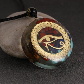 Horus Eye orgonite necklace; Handcrafted spiritual jewelry; Unique design symbolizing protection and insight; Artisan-crafted accessory; Ethically sourced materials; Gift for spiritual seekers and enthusiasts; Stylish and meaningful for everyday wear; Durable and fashionable; Beautifully detailed Eye of Horus symbol; Necklace for enhancing positive energy and protection; Natural elements for emotional balance and healing; Lightweight and comfortable;