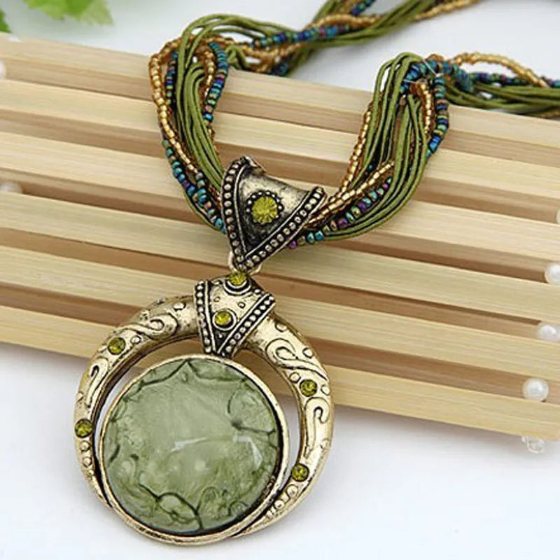 Mystical bohemian necklace; Unique handcrafted jewelry; Ethereal charm necklace; Bohemian style pendant; Spiritual and mystical jewelry; Natural stone bohemian necklace; Free-spirited fashion accessory; Handmade mystical pendant; Vibrant boho necklace design; Healing crystal jewelry; Earthy tones and textures; Perfect for layering; 