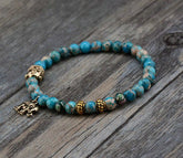 Buddhist bracelet; Natural stones bracelet; Handcrafted spiritual jewelry; Unique meditation accessory; Artisan-crafted bracelet; Ethically sourced natural stones; Bracelet for mindfulness; Gift for meditation practitioners; Healing energy bracelet; Calming meditation accessory; Bracelet for intention setting; Beautiful beaded bracelet; Unique spiritual gift; Bracelet for balance and harmony; Natural stones for grounding; Stylish and meaningful jewelry;