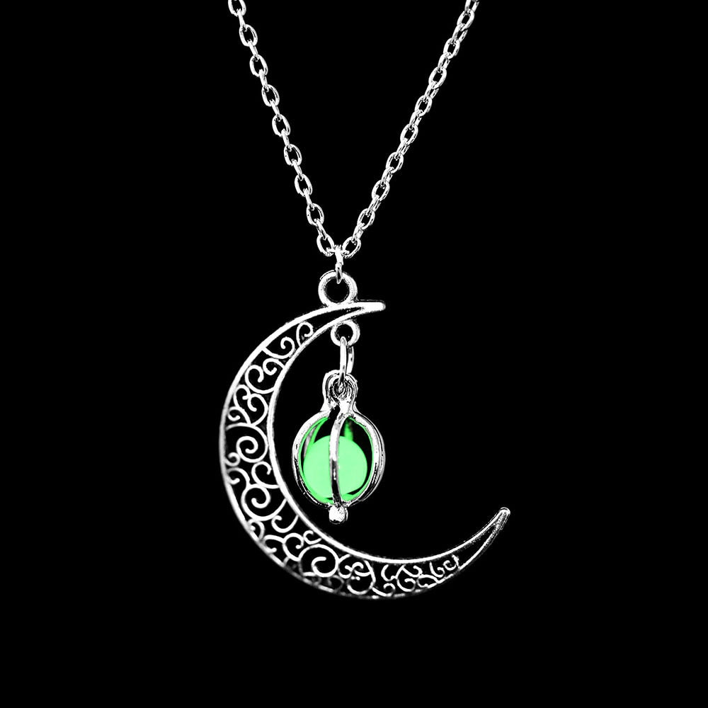 Luminous moon pendant necklace; Glows in the dark jewelry; Moon-inspired glowing necklace; Unique celestial necklace design; Captures the magic of the night sky; Perfect gift for moon lovers; Ethereal glow in the dark pendant; Handcrafted luminous jewelry; Stylish accessory for day or night; Symbol of mystery and elegance; Adds a touch of celestial beauty;