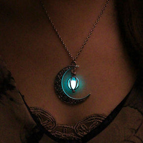 Luminous moon pendant necklace; Glows in the dark jewelry; Moon-inspired glowing necklace; Unique celestial necklace design; Captures the magic of the night sky; Perfect gift for moon lovers; Ethereal glow in the dark pendant; Handcrafted luminous jewelry; Stylish accessory for day or night; Symbol of mystery and elegance; Adds a touch of celestial beauty;