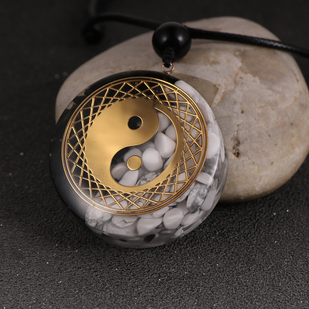Yin Yang orgonite necklace; Handcrafted spiritual jewelry; Unique design for balancing energies; Artisan-crafted accessory; Ethically sourced materials; Gift for those seeking harmony and balance; Stylish and meaningful for everyday wear; Durable and fashionable; Beautifully detailed Yin Yang symbol for duality and unity; Unique spiritual gift; Necklace for enhancing energy flow and protection; Natural elements for emotional healing and grounding;