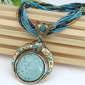 Mystical bohemian necklace; Unique handcrafted jewelry; Ethereal charm necklace; Bohemian style pendant; Spiritual and mystical jewelry; Natural stone bohemian necklace; Free-spirited fashion accessory; Handmade mystical pendant; Vibrant boho necklace design; Healing crystal jewelry; Earthy tones and textures; Perfect for layering; 