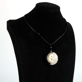 Yin Yang orgonite necklace; Handcrafted spiritual jewelry; Unique design for balancing energies; Artisan-crafted accessory; Ethically sourced materials; Gift for those seeking harmony and balance; Stylish and meaningful for everyday wear; Durable and fashionable; Beautifully detailed Yin Yang symbol for duality and unity; Unique spiritual gift; Necklace for enhancing energy flow and protection; Natural elements for emotional healing and grounding;