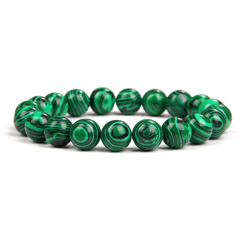 Malachite bracelet; Extraordinary healing energy bracelet; Handcrafted gemstone jewelry; Unique design for transformation and growth; Artisan-crafted accessory; Ethically sourced malachite; Gift for wellness seekers; Stylish and vibrant for everyday wear; Durable and fashionable; Beautifully polished malachite beads; Unique spiritual gift; Bracelet for emotional healing and balance; Natural stones for personal empowerment; Lightweight and comfortable; Ideal for meditation practices;