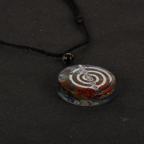 Reiki healing pendant; Cho Ku Rei energy transmuter; Orgonite 7 Chakras amulet; Spiritual energy protection; Chakra balancing necklace; Energy transmuting pendant; Reiki power symbol jewelry; Holistic healing amulet; Orgonite chakra harmonizer; Positive energy generator; Spiritual wellness accessory; Protective orgone energy pendant; Chakra alignment pendant;