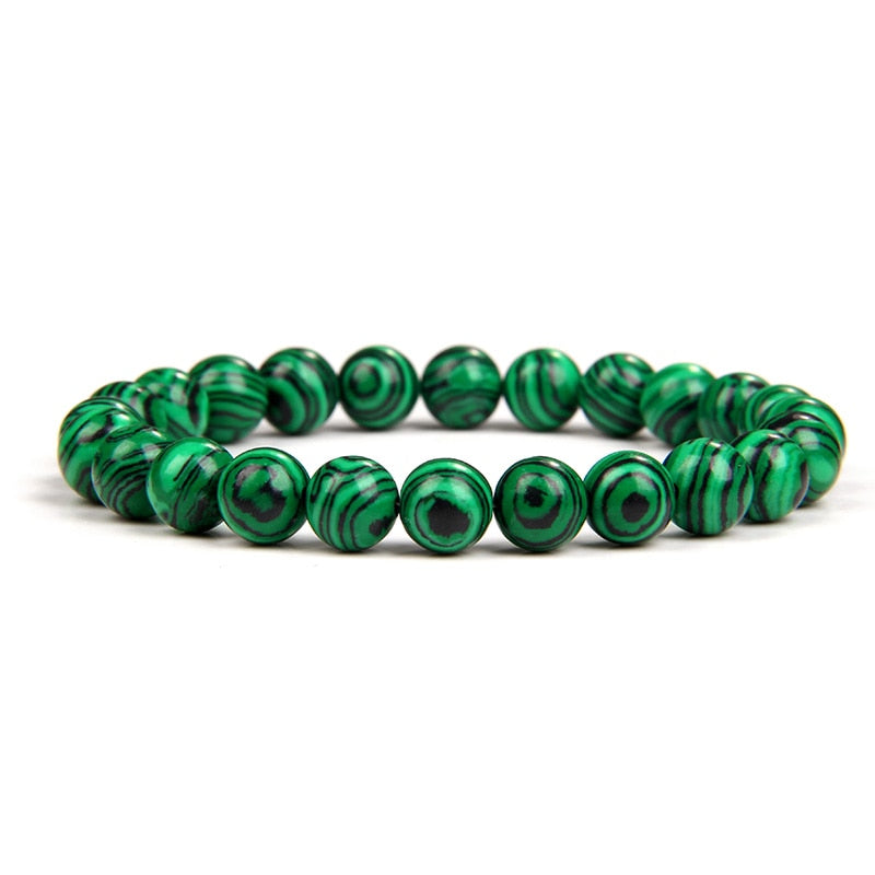 Malachite bracelet; Extraordinary healing energy bracelet; Handcrafted gemstone jewelry; Unique design for transformation and growth; Artisan-crafted accessory; Ethically sourced malachite; Gift for wellness seekers; Stylish and vibrant for everyday wear; Durable and fashionable; Beautifully polished malachite beads; Unique spiritual gift; Bracelet for emotional healing and balance; Natural stones for personal empowerment; Lightweight and comfortable; Ideal for meditation practices;