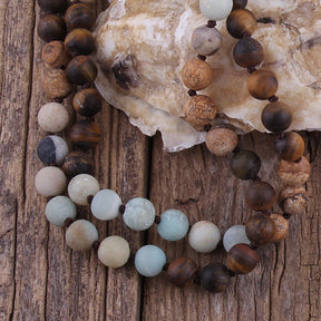 Tribal 108 bead japamala; Handcrafted natural stone mala; Unique tribal prayer beads; Spiritual jewelry; Meditation accessory; Artisan-crafted japamala; Natural stone beads; Japamala for mindfulness; Gift for meditation enthusiasts; Ethically sourced materials; Japamala for mantra repetition; Colorful tribal design; Japamala for spiritual growth; Beautiful beaded necklace; Unique spiritual gift; Japamala for intention setting; Calming meditation beads;