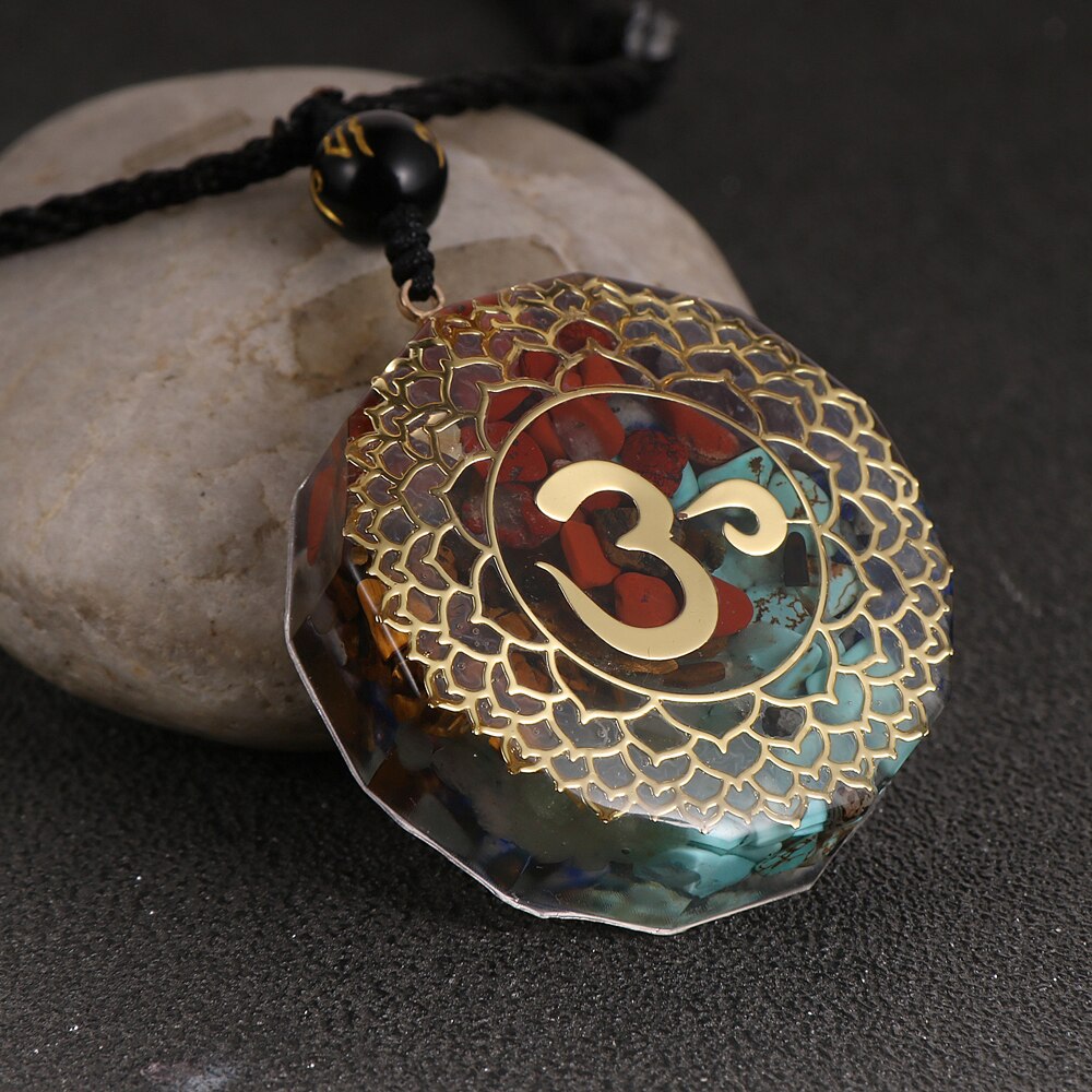 Orgonite OM necklace; Handcrafted spiritual jewelry; Unique design for energy protection and balance; Artisan-crafted accessory; Ethically sourced materials; Gift for meditation and mindfulness enthusiasts; Stylish and meaningful for everyday wear; Durable and fashionable; Beautifully detailed OM symbol for spiritual connection; Unique spiritual gift; Necklace for enhancing personal energy and harmony; Natural elements for emotional healing and grounding;