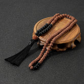 Rudraksha and Onyx japamala; Protection mala necklace; 108 beads prayer necklace; Handcrafted spiritual jewelry; Natural Rudraksha seeds; Onyx stone for protection; Artisan-crafted japamala; Japamala for mindfulness; Free bracelet included; Gift for meditation enthusiasts; Japamala for spiritual growth; Japamala for protection and grounding; Beautiful beaded necklace; Unique spiritual gift; Japamala for intention setting; Calming meditation accessory;