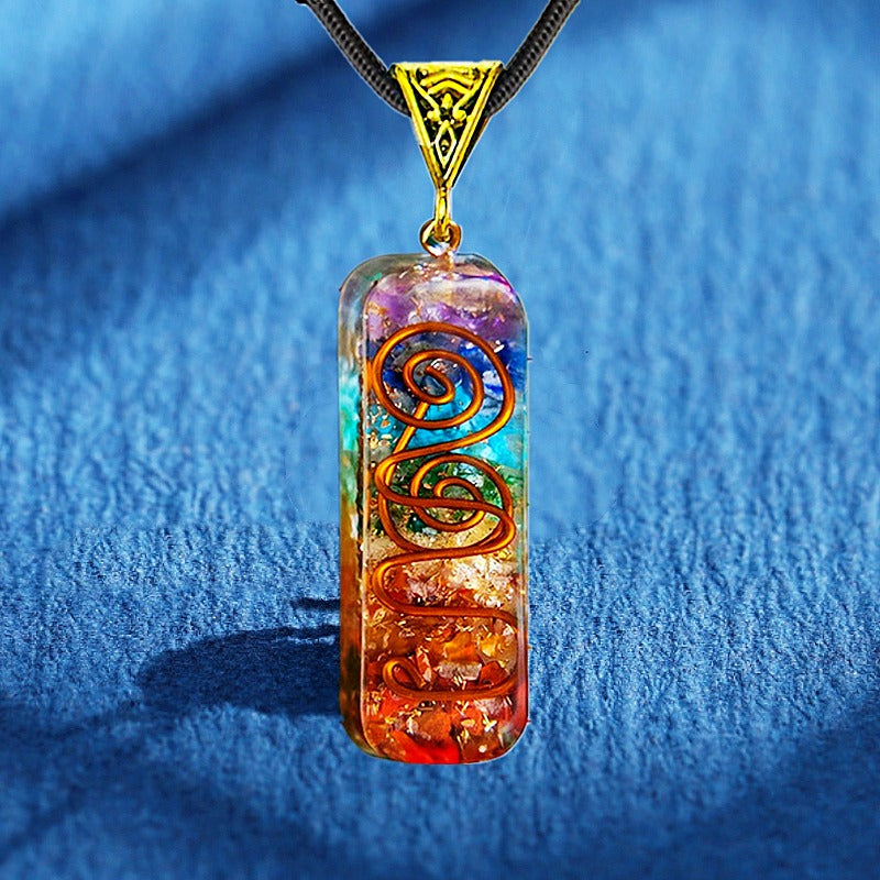 Orgonite energy flow necklace; 7 chakras amulet for balance; Enhances energy flow and healing; Unique blend of natural crystals and resin; Promotes emotional well-being and harmony; Beautifully crafted for everyday wear; Supports spiritual growth and protection; Ideal gift for holistic health enthusiasts; Handcrafted with care and intention; Vibrant colors representing each chakra; Lightweight and comfortable design;