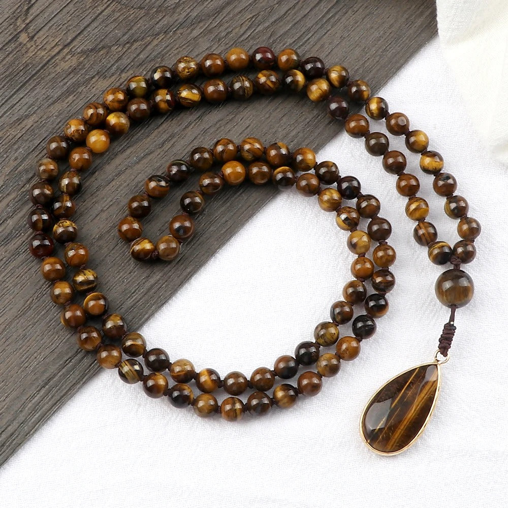 108 bead japamala; Tiger's Eye medal necklace; Handcrafted prayer beads; Spiritual jewelry; Artisan-crafted japamala; Natural Tiger's Eye beads; Japamala for mindfulness; Gift for meditation practitioners; Japamala for focus and protection; Healing energy necklace; Tiger's Eye for confidence and strength; Unique meditation necklace; Japamala for mantra repetition; Calming meditation accessory; Beautiful beaded necklace; Unique spiritual gift;